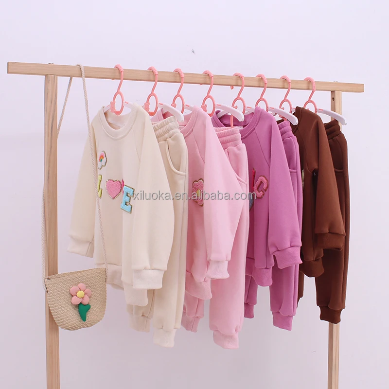 Wholesale bamboo baby clothing collection featuring custom pajamas, onesies, and rompers; eco-friendly, soft, and perfect for retailers.