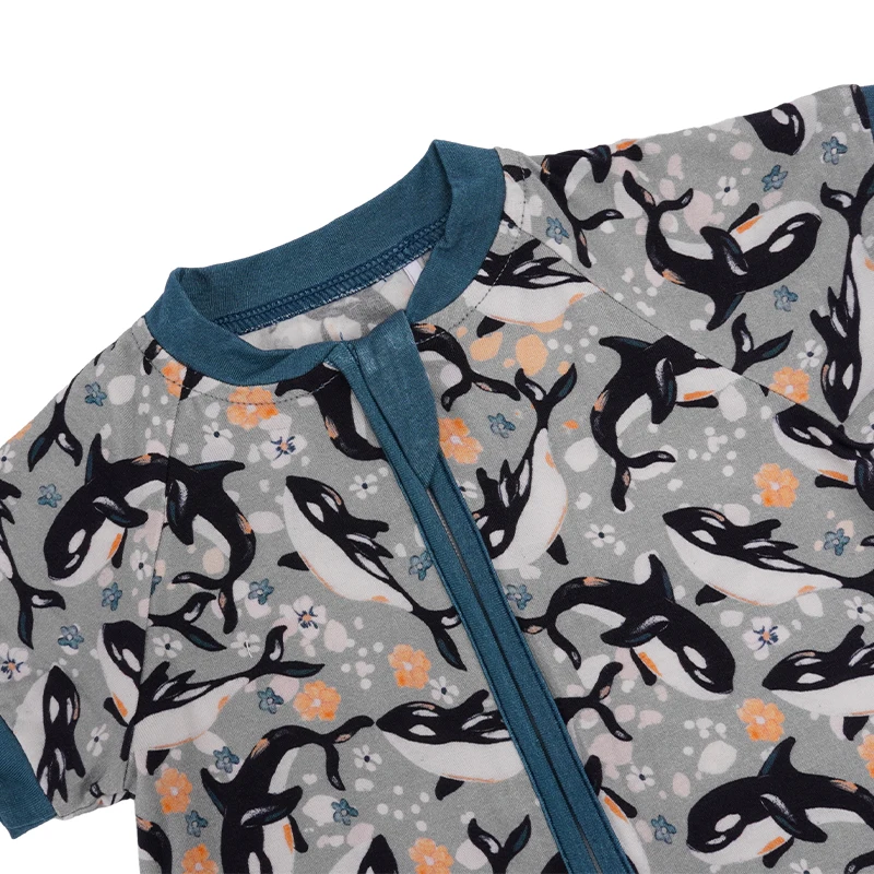 Adorable baby wearing bamboo moomoo pocket romper, perfect for eco-conscious B2B wholesale buyers seeking premium baby clothing.